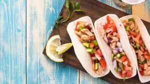 Juicy chicken fajitas in a skillet, paired with sautéed bell peppers and onions, perfect for the best recipe for chicken fajitas.