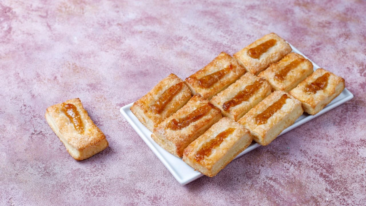 Crispy frozen French toast sticks in air fryer basket ready to serve